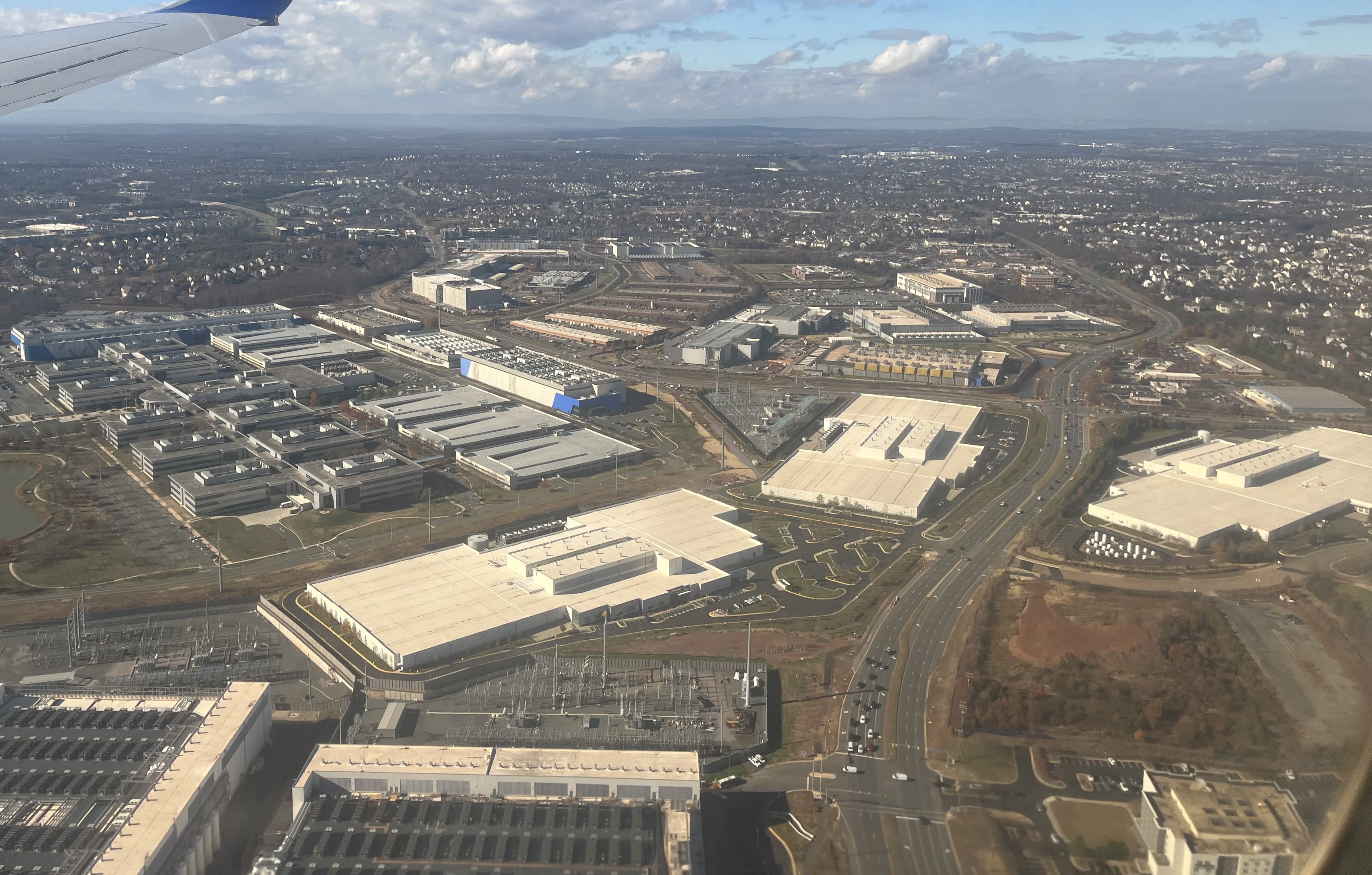 Aerial view from an airplane of data centers and substations in Loudoun County, Virginia, in 2025.